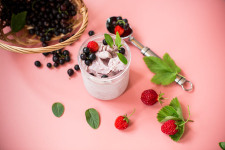 Berry ice cream with natural ingredients on background.
