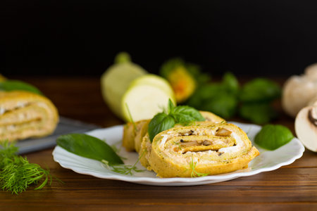 Homemade zucchini roll with mushroom filling.