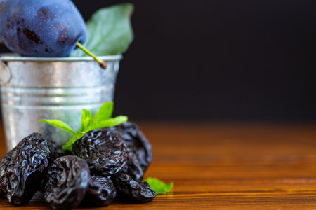 Healthy prunes and sweet plum with antioxidant vitamins.の写真素材