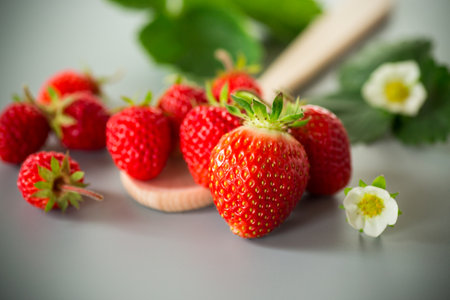 Top view of red strawberries with a gray background.の写真素材
