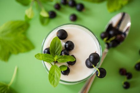 Blackcurrant in homemade yogurt, top view.
