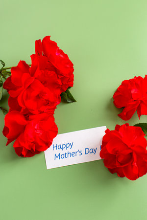 Bright scarlet roses for mom on green background.の写真素材