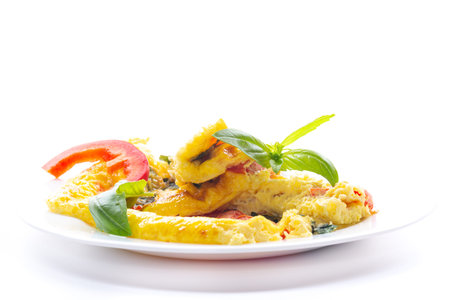 Fried eggs for breakfast with vegetables and herbs.の写真素材