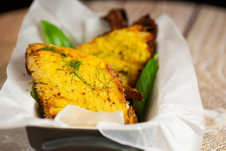 Healthy vegetarian baked cabbage slices with golden crust.の写真素材