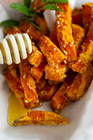 Healthy grilled pumpkin pieces drizzled with natural honey.の写真素材