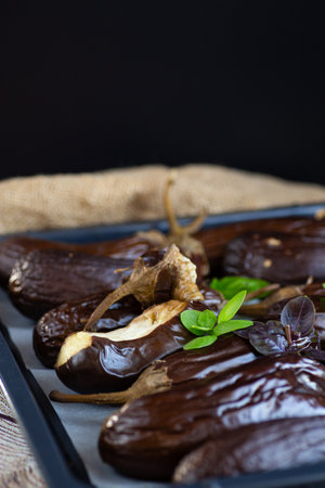 natural baked eggplants close-up on a dark background.の写真素材