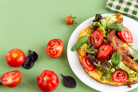 Fitness dish omelette with arugula, spinach and sweet pepper.の写真素材