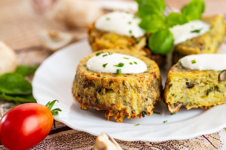 Rustic homemade potato and mushroom muffins with green garnish.