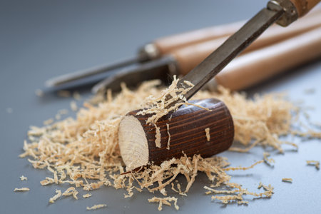 Shavings and wooden mallet on gray background.の写真素材