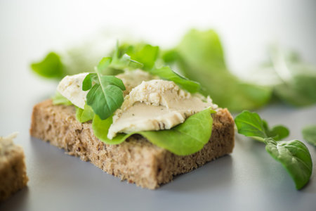 Close-up of a sandwich with salad leaves.の写真素材