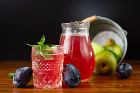 Healthy vitamin drink with summer fruits and greens for the table.