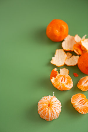 Citrus composition with whole mandarins and separated fruit slices.の写真素材