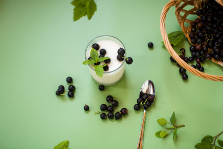Aesthetic serving of yogurt with blackcurrant berries.の写真素材