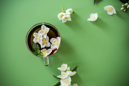 Green tea with jasmine in a glass teapot from above.の写真素材