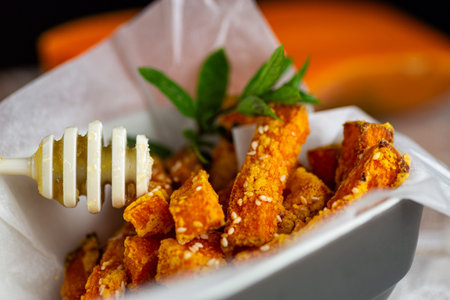 Roasted pumpkin served with sweet honey glaze and sesame.