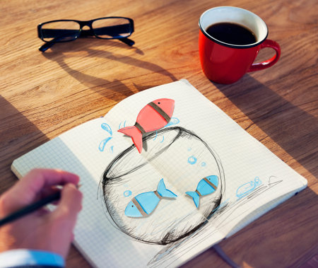 Man Drawing Fishes on a Fish bowl