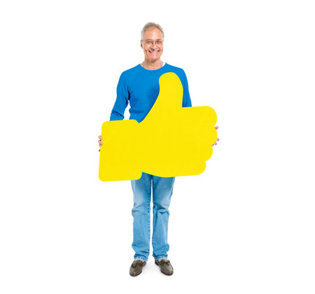 Casual Mature Man Giviing Thumbs Up