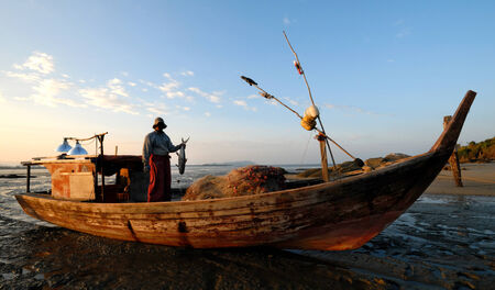 Malaysian fisherman showing his catch.