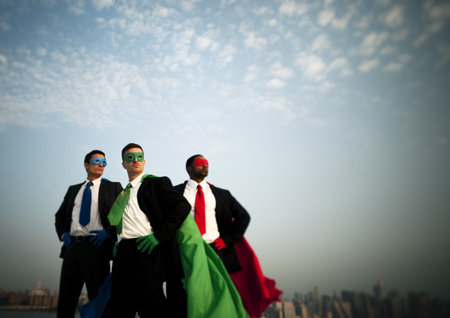 Business superheroes at city skyline.