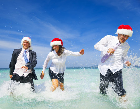 Office worker having Fun on the beach on Christmas