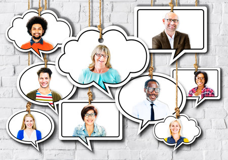 Group of People Smiling in Speech Bubble on Bricks Wall