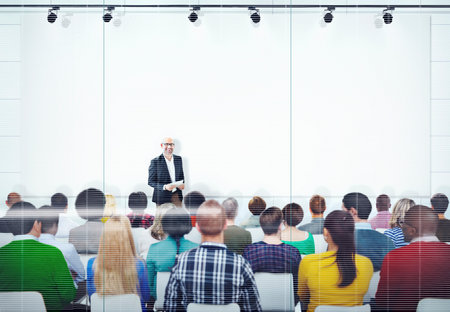 People Listening to the Speaker's Presentation
