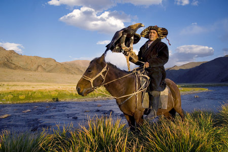 Kazakh men traditionally hunt foxes and wolves using trained golden eagles. Olgei,Western...