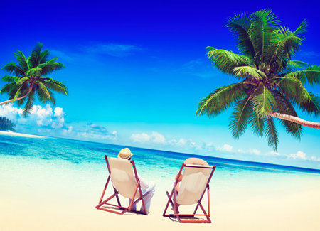 Couple Relaxing on the Beach Tourism Nature Concept