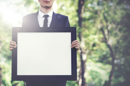 Businessman Holding Picture Frame Copy Space Concept