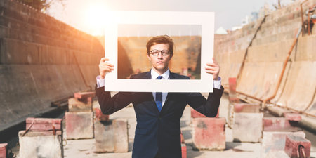 Businessman Picture Frame Holding Concept