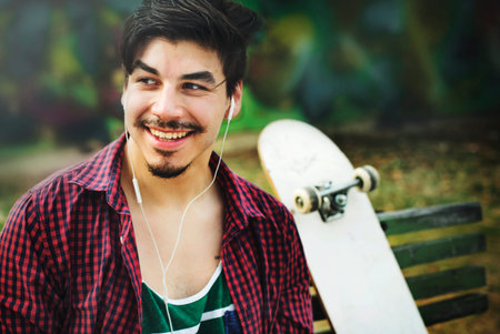 Skateboarding Sitting Relaxation Park Holiday Concept