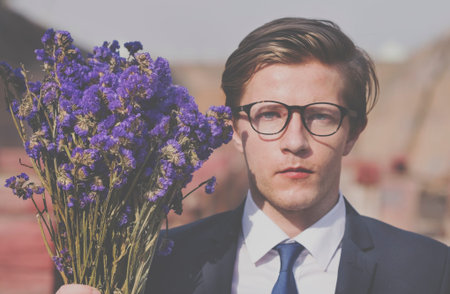 Businessman Purple Flower Holding Concept