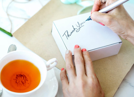 Unwrapped Present Writing Thankyou Message Concept