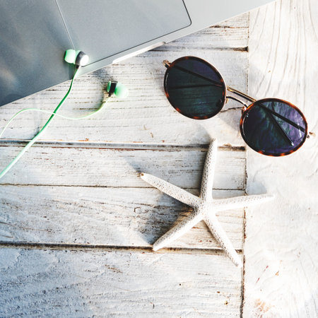 Laptop Sunglasses Seashell Concept