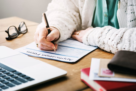 Senior Woman Filling Application Form Documents Concept