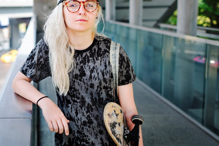 Young Woman Skateboard Standing Outdoors Bridge Concept