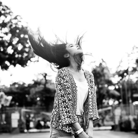 Young Girl Hair Fling Funfair Festive Playful Happiness Concept