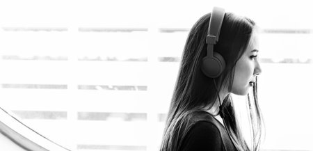 Young Woman Listening Music Concept