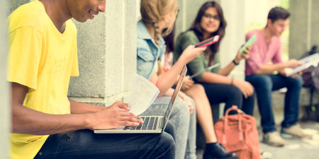 Young Diverse Group Studying Outdoors Concept