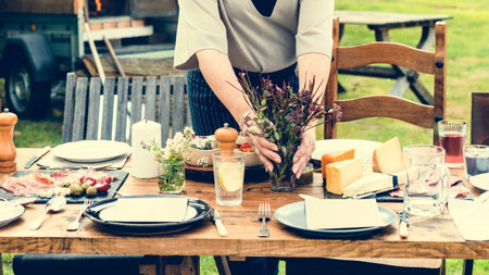 Woman Preparing Table Dinner Concept