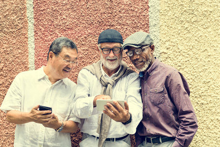 Group Of Senior Retirement Using Digital Devices Concept