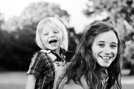 Sister Brother Togetherness Outdoors Piggyback Concept