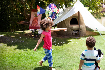 Young Siblings Playing Outdoors Concept