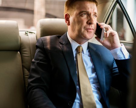 Businessman Talking Using Phone Car Inside