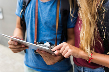 Couple traveling using tablet wanderlust