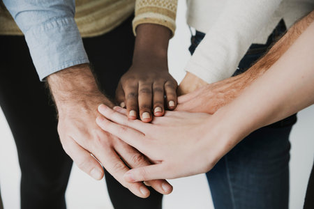 Pile of hands unity teamwork diverse people