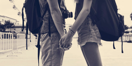 Couple holding hands park background