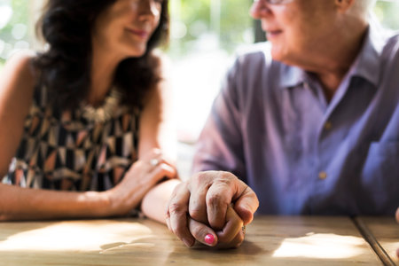 Mature people romantic holding hands