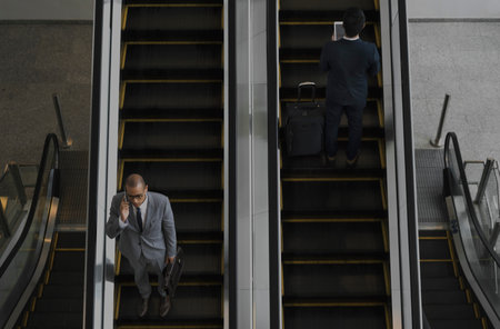 Business Men Escalator Talk Mobile