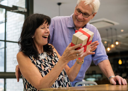 Husband giving wife a box present